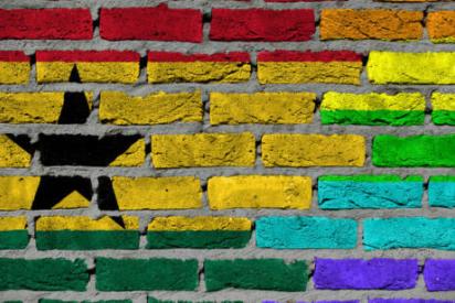 Dark brick wall texture - coutry flag and rainbow flag painted on wall - Ghana